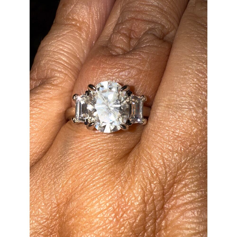 3CT oval moissanite with side baguettes